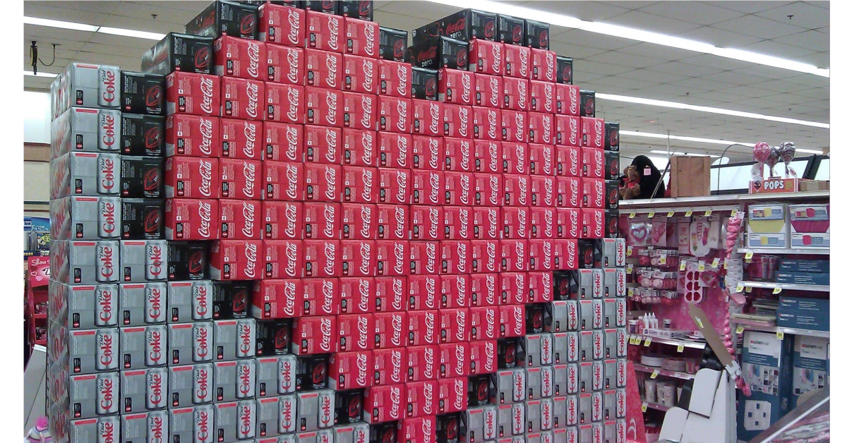 coca-cola boxes stacked in the shape of a heart